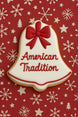 Decorative cookie shaped like a bell with a red bow and 'American Tradition' text on a red background with snowflakes from a 3.5 inch Bell Metal Cookie Cutter