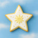 Decorative star-shaped cookie featuring yellow and white icing, inspired by the 2.5 inch Star Metal Cookie Cutter.
