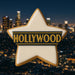 3.5 inch Star Metal Cookie Cutter shaped cookie with 'HOLLYWOOD' decoration against a night city skyline backdrop.