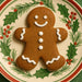 2.25 inch Mini Gingerbread Boy Metal Cookie Cutter with decorated gingerbread boy cookie on holly plate.