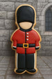 5 inch English Guard Nutcracker Metal Cookie Cutter shaped cookie decorated in red and black.