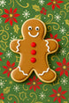 3.5 inch Folk Gingerbread Boy Metal Cookie Cutter shaped cookie decorated with icing on holiday pattern backdrop.