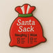 Decorative sack shaped like a red Santa sack with 'Santa Sack' text on a beige background from a 3.5 inch Santa Potato Money Sack Metal Cookie Cutter