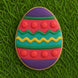 Colorful Easter egg cookie on grass from a 2.5 inch Easter Egg Metal Cookie Cutter