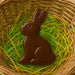 5 inch Chocolate Easter Bunny Rabbit Metal Cookie Cutter in brown chocolate within a colorful basket of grass.