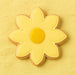 flower-shaped cookie with yellow icing on a yellow background from a 3.5 inch Daisy Flower Metal Cookie Cutter