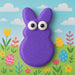 3.75 inch Easter Bunny Rabbit Metal Cookie Cutter with purple bunny design against a colorful spring background.