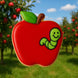 Red apple-shaped cookie with a green worm on a blurred background of apple trees from a 3 inch Apple Metal Cookie Cutter
