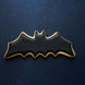 4 inch Flying Bat Metal Cookie Cutter shaped bat cookie decorated in black icing on a starry background.