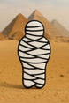 Mummy-shaped cookie with pyramids in the background from a 5 inch Mummy Metal Cookie Cutter