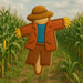 4 inch Scarecrow Metal Cookie Cutter shaped cookie decorated in a cornfield, perfect for autumn baking.