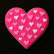 Heart-shaped cookie with pink and white heart decorations on a black background from a 2.25 inch Heart Metal Cookie Cutter