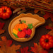 3 inch Cornucopia Metal Cookie Cutter with colorful fall fruits design on a warm autumn background.