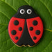 Cookie shaped like a ladybug on a green leaf from a 3 inch Ladybug Metal Cookie Cutter