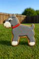 4.75 inch Schnauzer Metal Cookie Cutter shaped cookie with gray icing and red collar on grass.