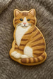 Cat-shaped cookie on a textured surface from a 3 inch Pussy Cat Metal Cookie Cutter