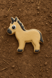 Cookie-shaped donkey on a brown textured surface from a 3.75 inch Donkey Metal Cookie Cutter