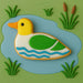 Decorative duck cookie on a green background with water and reeds from a 4.75 inch Loon Metal Cookie Cutter