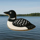 Loon-shaped cookie on a body of water with trees in the background from a 4.75 inch Loon Metal Cookie Cutter