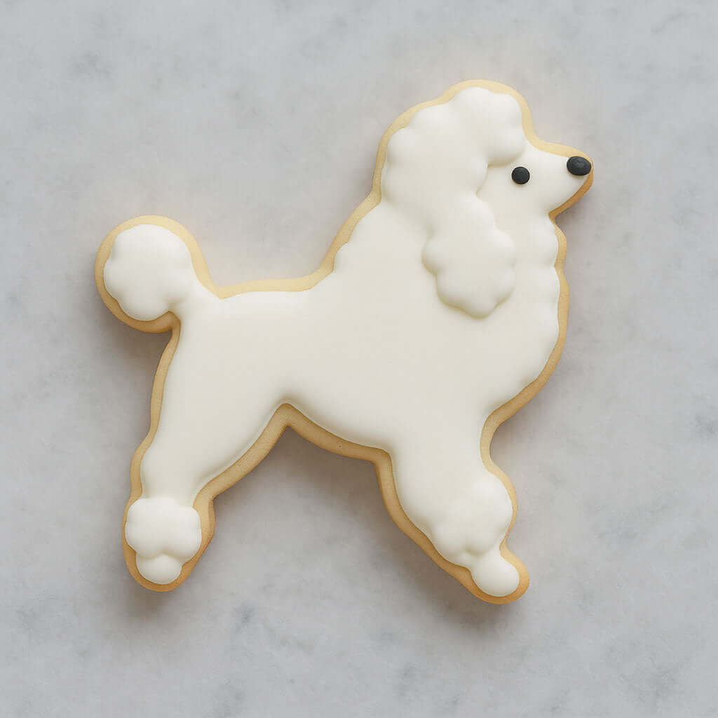 4 inch Poodle Metal Cookie Cutter shaped cookie decorated with white icing, perfect for vintage-themed baking.