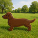 5.5 inch Dachshund Metal Cookie Cutter displayed on grass, showcasing its detailed design and charming dachshund shape.