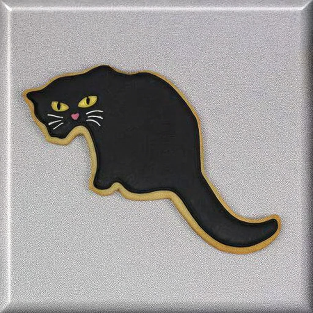 Black cat-shaped cookie on a silver background from a 5.5 inch Cat Metal Cookie Cutter