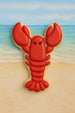 4 inch Lobster or Crawfish Metal Cookie Cutter shaped cookie on a beach background.