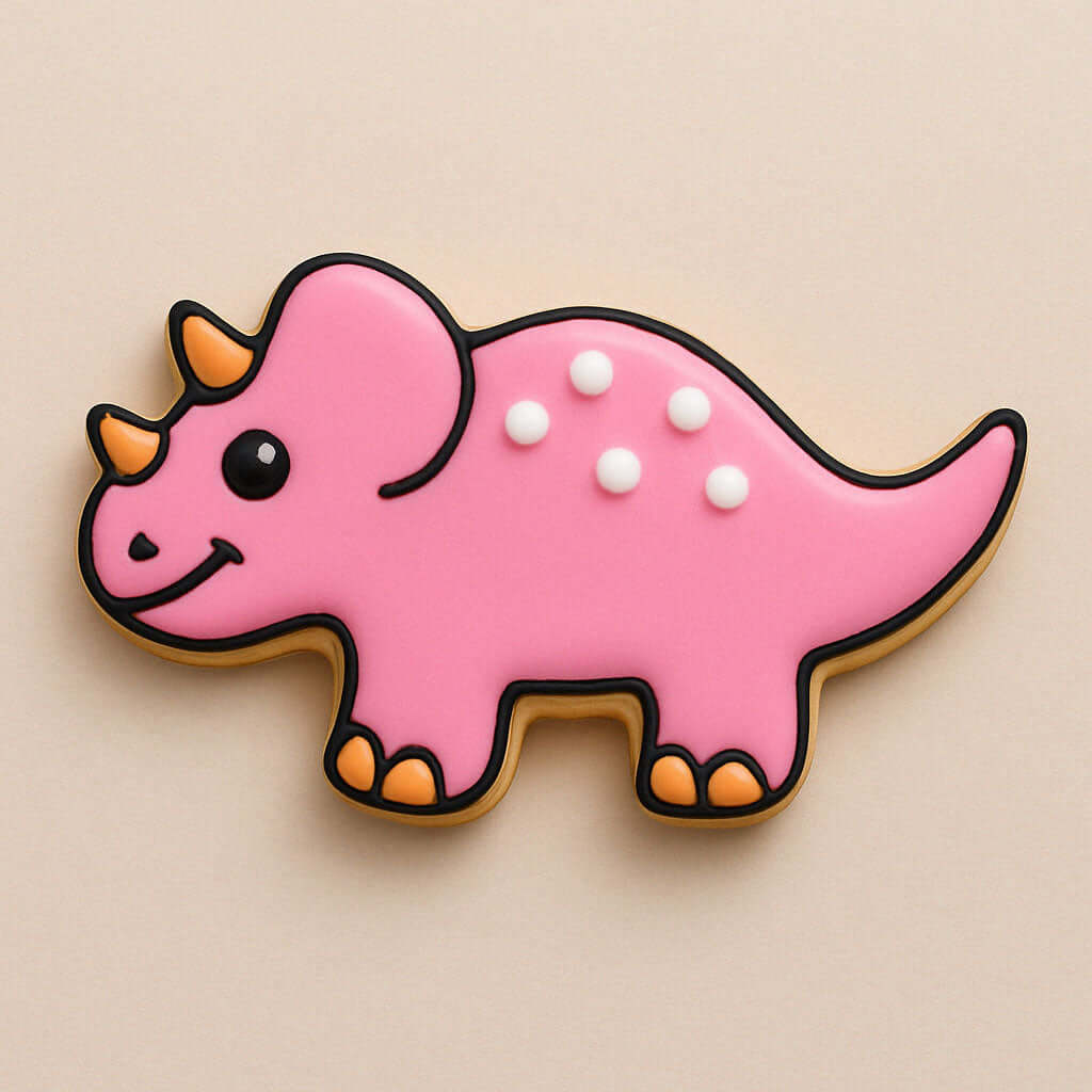 Pink triceratops-shaped cookie on a beige background from a 4 inch Triceratops Metal Cookie Cutter
