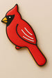 Red cardinal-shaped cookie on a beige background from a 4.5 inch Cardinal Metal Cookie Cutter