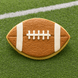Football-shaped cookie on a green field background from a 3.5 inch Football Metal Cookie Cutter