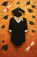 4.75 inch Graduation Graduate Metal Cookie Cutter shaped cookie featuring a graduate in a black gown and cap.