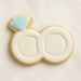 Cookie shaped like a wedding ring with a blue gemstone on a light background from a 4.5 inch Double Engagement Wedding Rings Metal Cookie Cutter