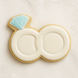 Cookie shaped like a wedding ring with a blue gemstone on a light background from a 4.5 inch Double Engagement Wedding Rings Metal Cookie Cutter