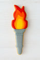 Decorative cookie shaped like a torch with flames on a white background from a 5 inch Torch Metal Cookie Cutter