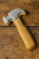 4.5 inch Hammer Metal Cookie Cutter shaped cookie on wooden surface.