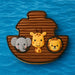 Noah's ark with elephant, giraffe, and lion on a blue water background from a 5 inch Noah's Ark Metal Cookie Cutter