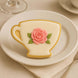 Decorative cookie shaped like a teacup with a pink rose on a white plate from a 3 inch Teacup Metal Cookie Cutter