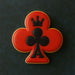 Cookie with a red clover design and black king of clubs symbol on a dark background from a 3.5 inch Club Metal Cookie Cutter