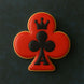 Cookie with a red clover design and black king of clubs symbol on a dark background from a 3.5 inch Club Metal Cookie Cutter