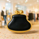 Black clutch with gold rim and bow cookie on a blurred indoor background from a 4 inch Purse Metal Cookie Cutter