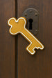 Decorative key-shaped door cookie on a wooden door from a 5.25 inch Skeleton Key Metal Cookie Cutter