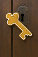 Decorative key-shaped door cookie on a wooden door from a 5.25 inch Skeleton Key Metal Cookie Cutter