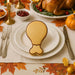 Thanksgiving table setting with a turkey-shaped cookie on a plate, surrounded by fall decorations from a 2 inch Mini Turkey Chicken Leg Drumstick Metal Cookie Cutter