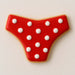 Decorative cookie shaped like a bikini bottom, featuring red icing with white polka dots, perfect for summer treats from a 4 inch Bikini Bottom Metal Cookie Cutter
