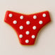 Decorative cookie shaped like a bikini bottom, featuring red icing with white polka dots, perfect for summer treats from a 4 inch Bikini Bottom Metal Cookie Cutter