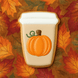 Pumpkin spice latte cookie with a pumpkin on top against an autumn leaf background from a 4 inch Paper Coffee Travel Mug Metal Cookie Cutter