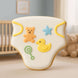 Cookie shaped like a baby diaper with teddy bear, star, and duck decorations in a nursery setting from a 4 inch Baby Diaper Metal Cookie Cutter