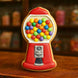 Cookie shaped like a gumball machine with colorful gumballs on a wooden surface from a 4.5 inch Gumball Machine Metal Cookie Cutter