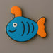 Fish-shaped cookie with blue body, orange tail and fins on a gray background from a 4 inch Submarine Metal Cookie Cutter