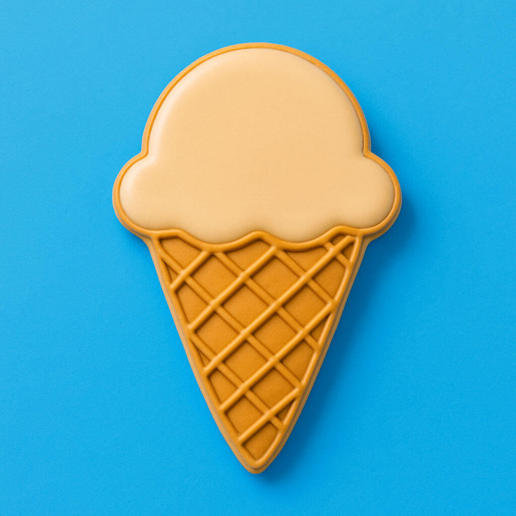 Ice cream cone-shaped cookie on a blue background from a 4 inch Ice Cream Cone Metal Cookie Cutter